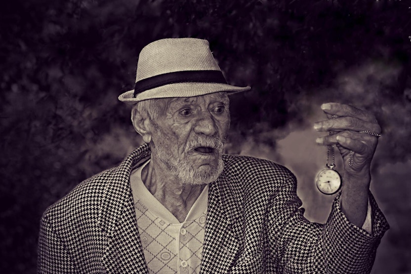 Source:https://www.pexels.com/photo/man-holding-pocket-watch-in-grayscale-160785/