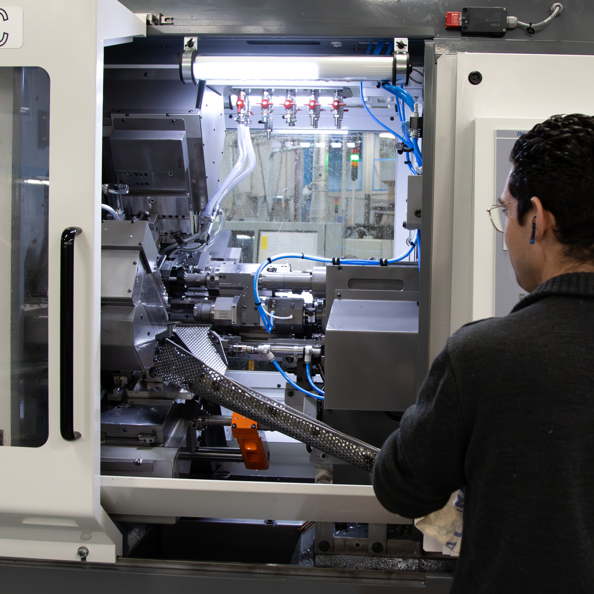 Person in front of a machining center