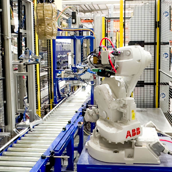 Robotic arm on an assembly line