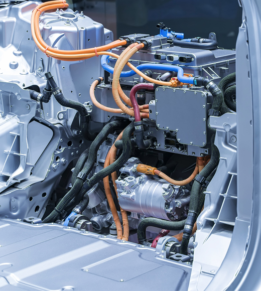 Zoom in on a part of a car under construction, showing different elements connected by cables or joints