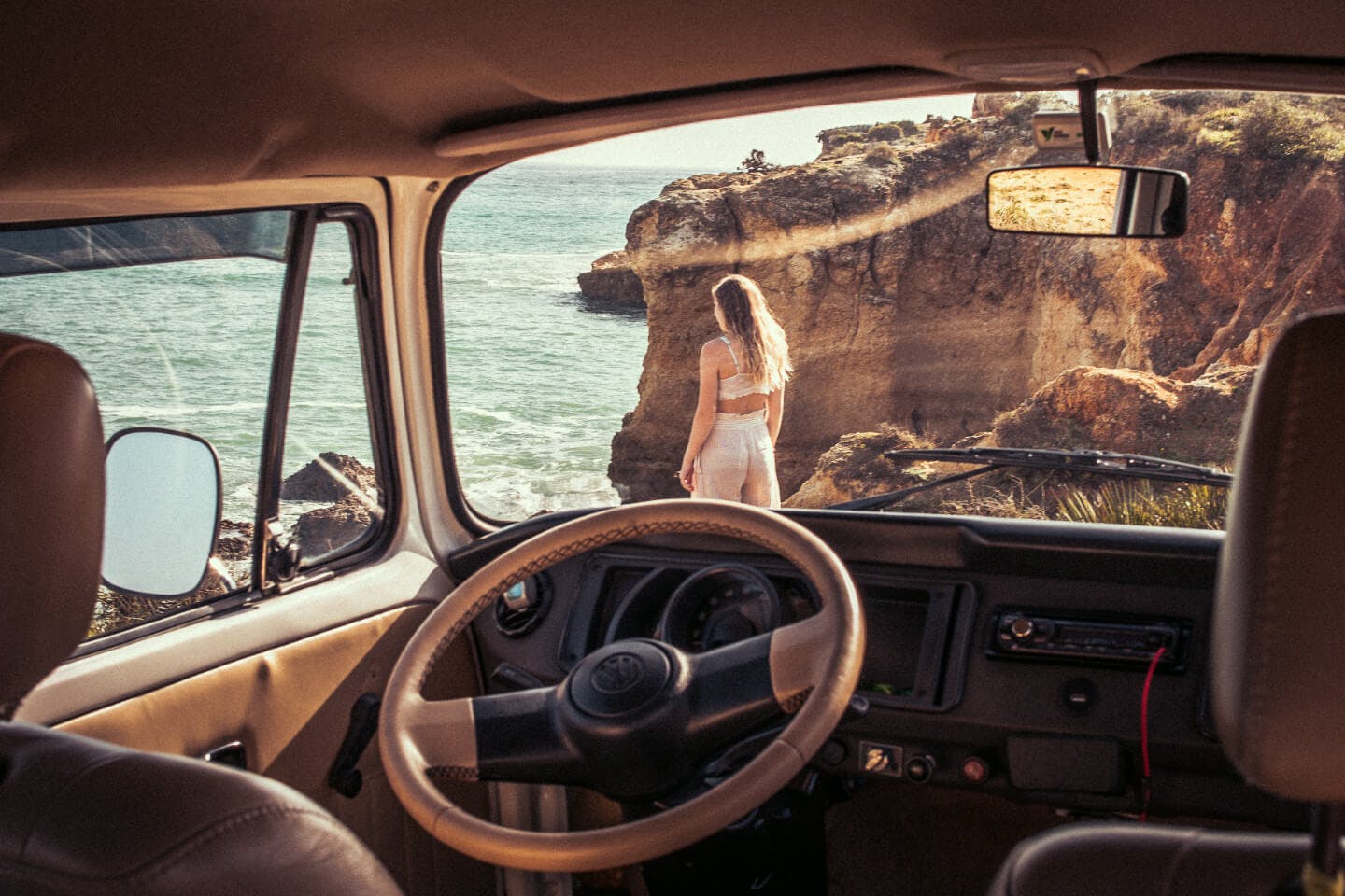 Woman admiring the Algarve coast.
