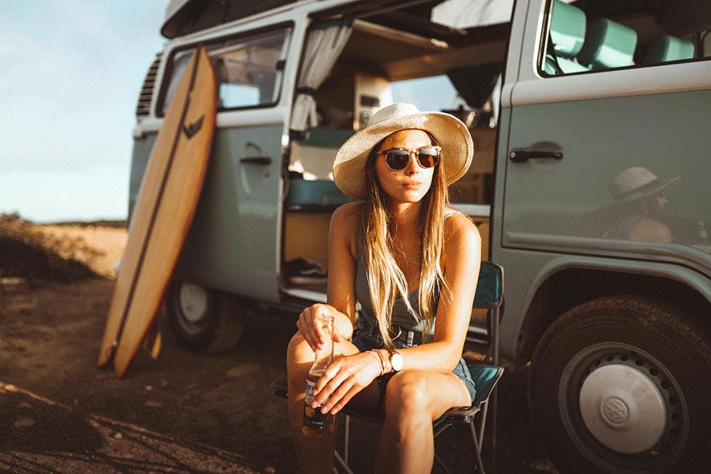 Woman traveller enjoying her sunny and cheap holidays to Portugal.