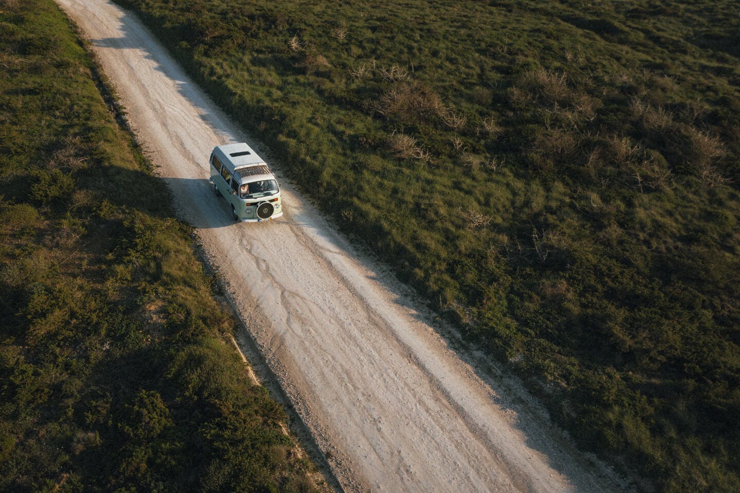 Campervan on dirt road in Alentejo, Portugal.