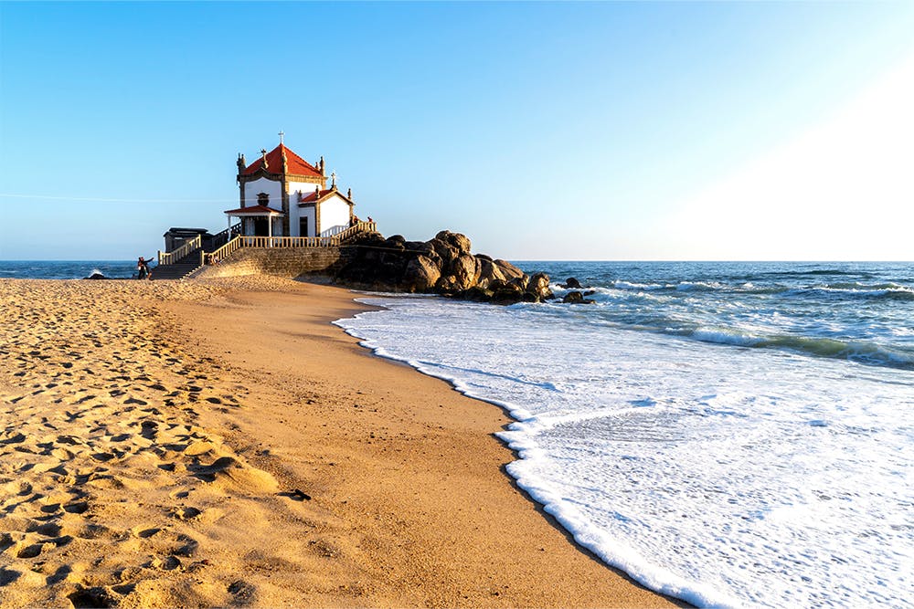 Chapel Senhor da Pedra sits along Miramar Beach in Vila Nova de Gaia, northern Portugal.