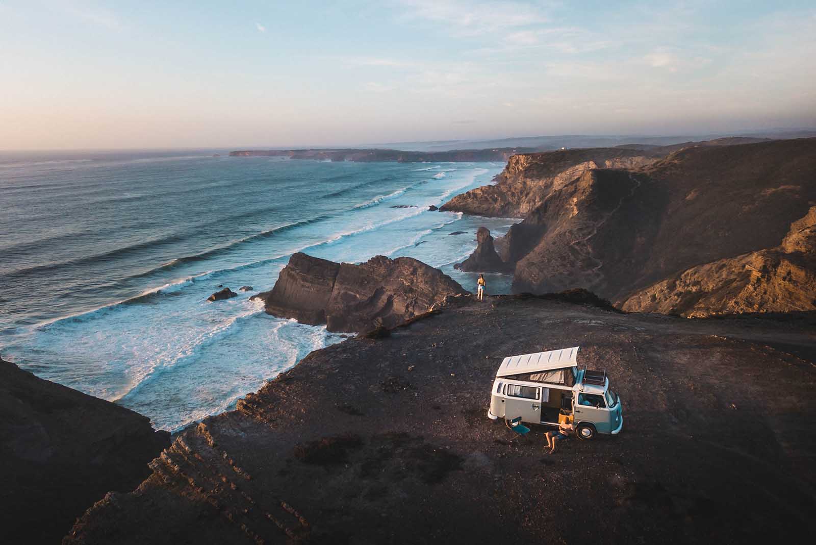 Couple on holiday making the most of their campervan hire in Portugal.