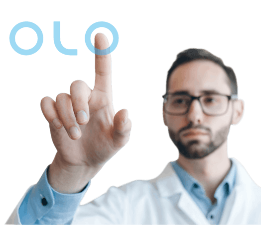 Male lab manager pointing up at olo logo 