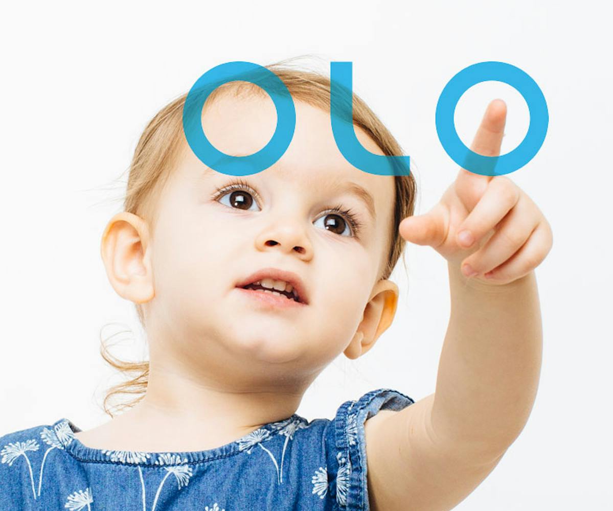 Child pointing at OLO logo