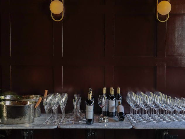 Image of bottles of wine and glasses