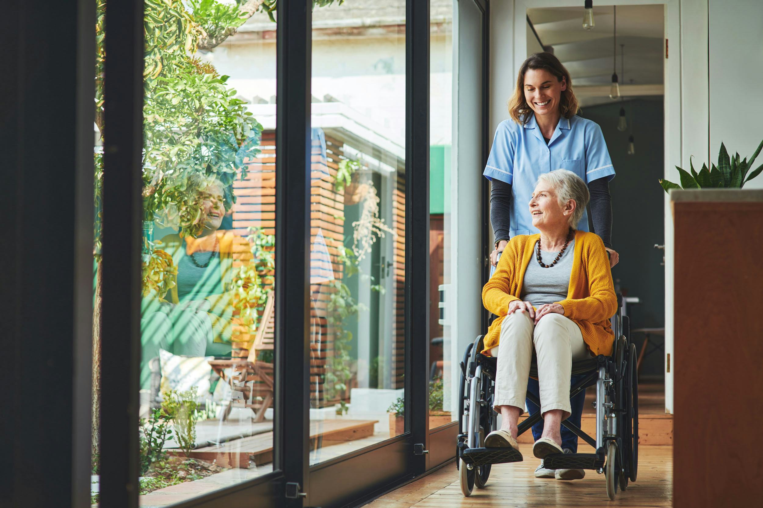 Aged care facility shows a nurse and elderly