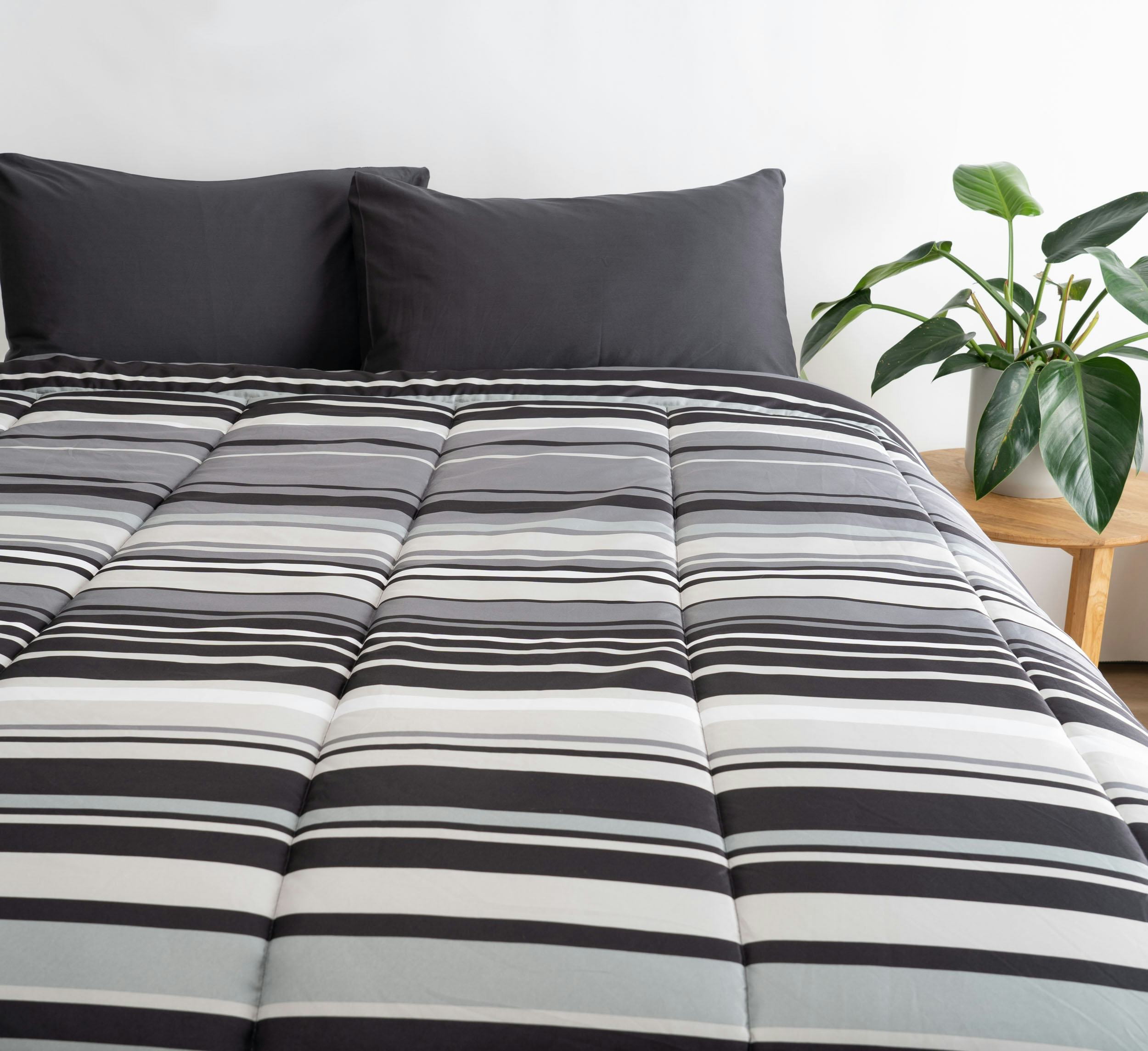 Stripy sheets on a bed