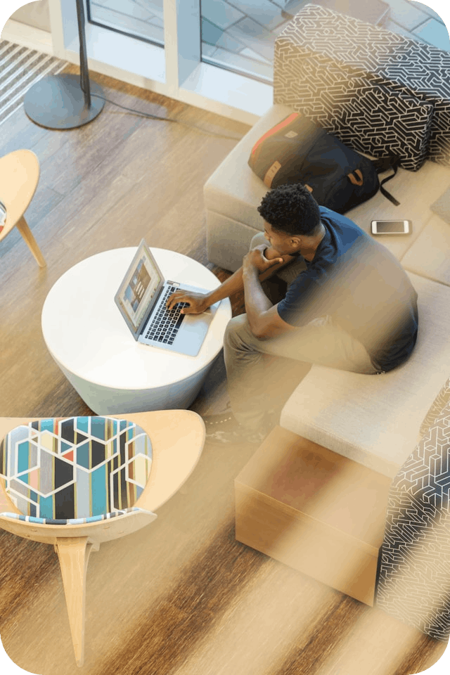 image of person on a laptop from above