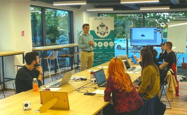 picture of Louis Havriliuc, Simbound founder with participants at a Simbound workshop