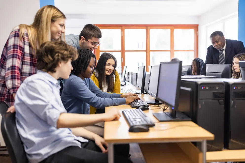 students working in a team at a computer
