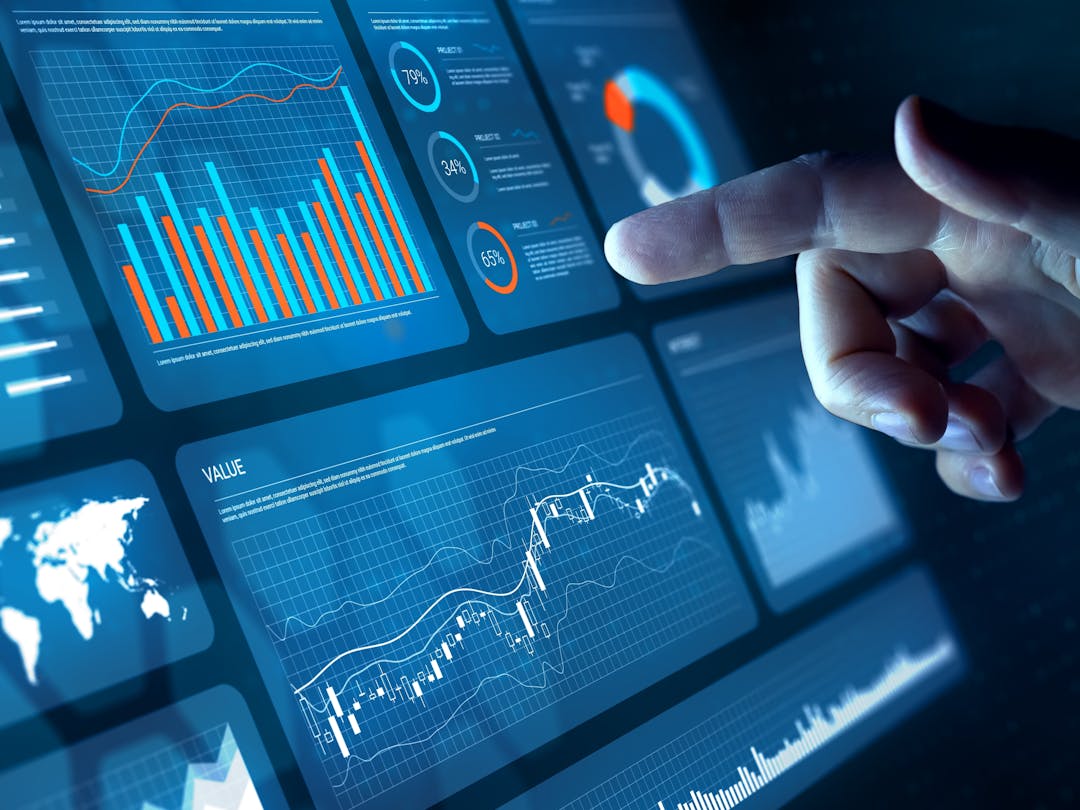 A touch screen displaying a dashboard user interface composed of info-graphics and controls