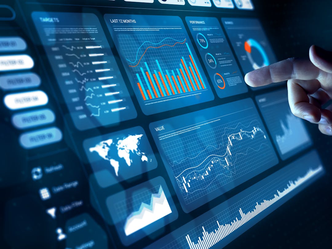 A touch screen displaying a dashboard user interface composed of info-graphics and controls