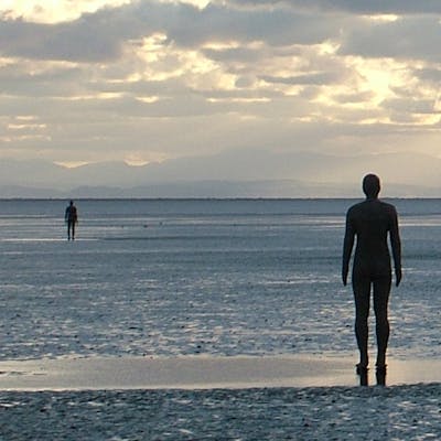 Unsettling sculpture - Another Place by Antony Gormley