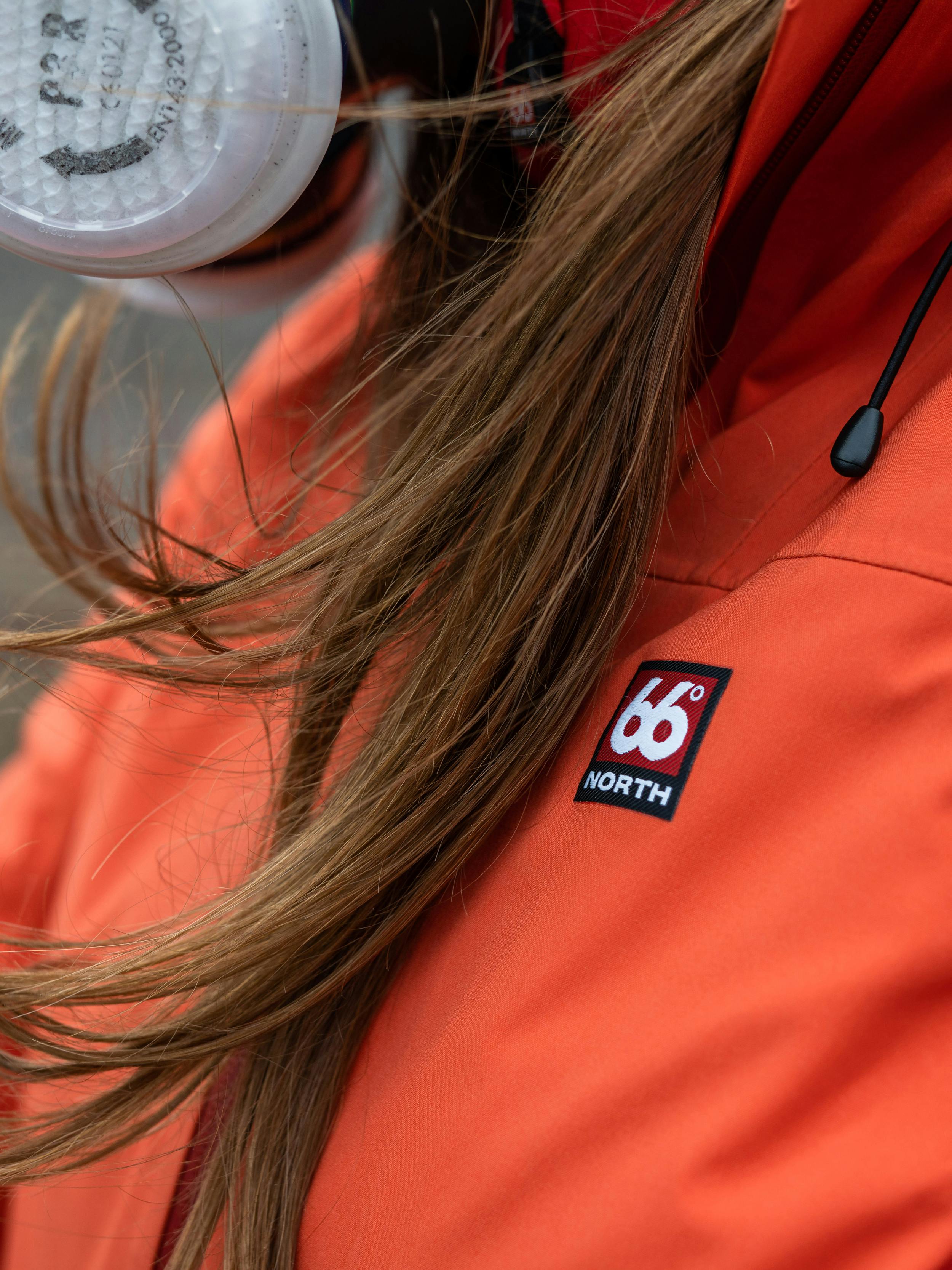 Helga in a gas mask and a 66°North jacket