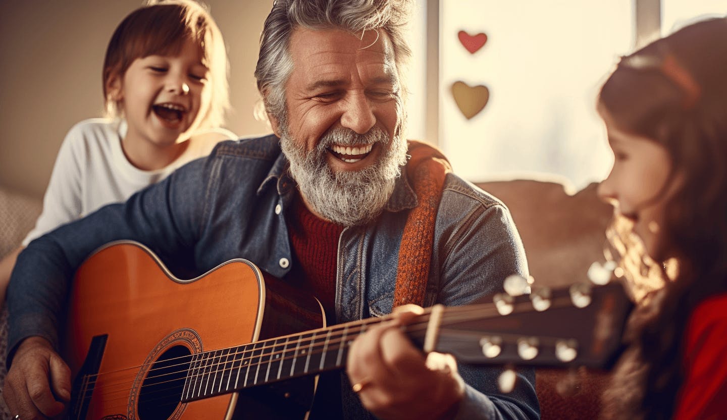 Un grand-père jouant de la guitare pour ses petits enfants