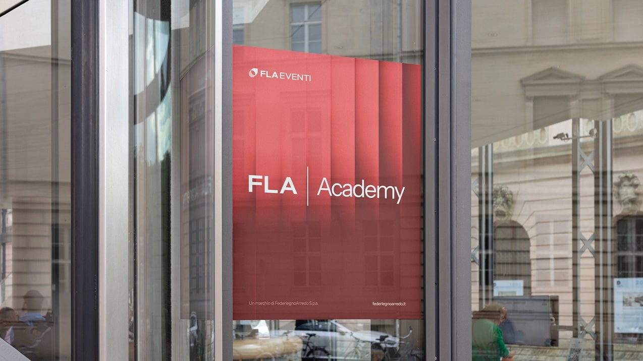Visual grafico FLA Assoluce con slogan 'Light for life, Light for spaces' su sfondo viola, brand di FederlegnoArredo dedicato all’illuminazione.