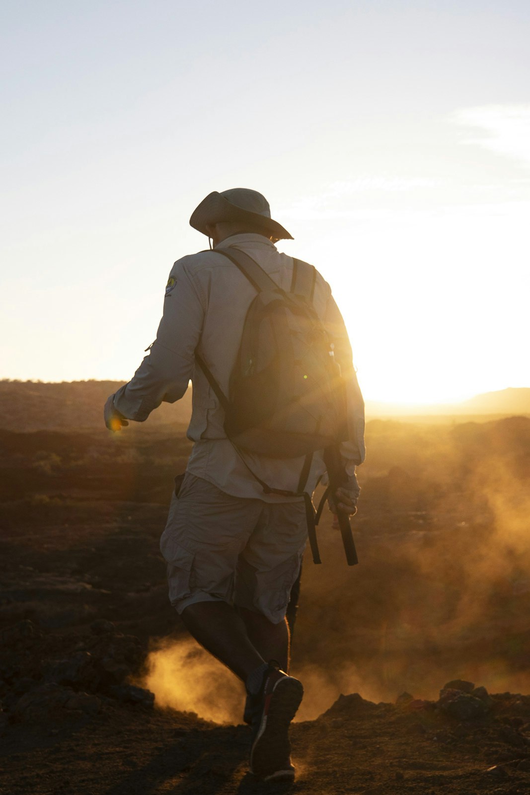 Sketchin - Case - Silversea Silver Origin Galapagos Islands - panoramic view, man walking on solid lava, rock lava, igneous rock in the sunset