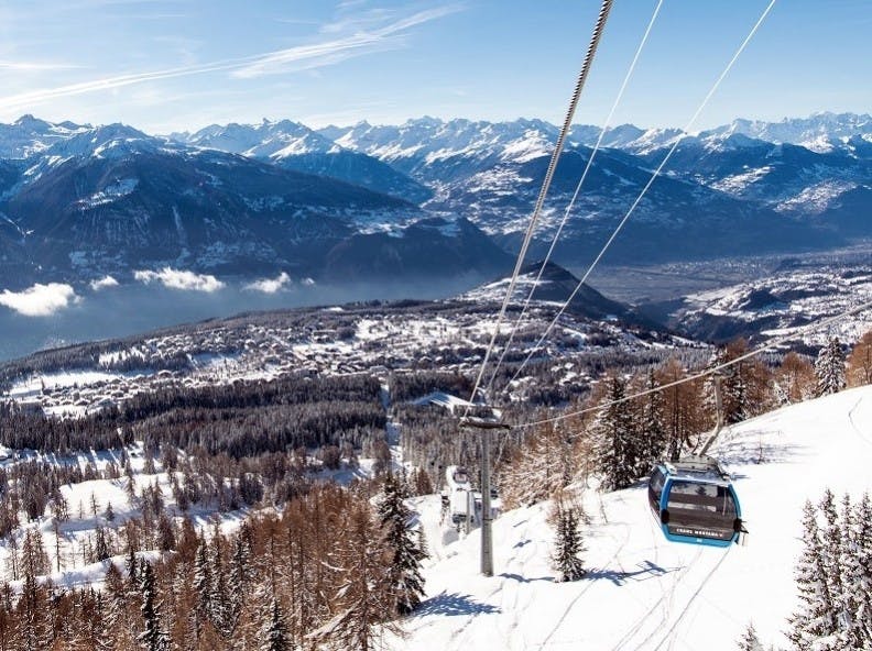 The gondola and snowy mountains at Crans-Montana Ski Resort