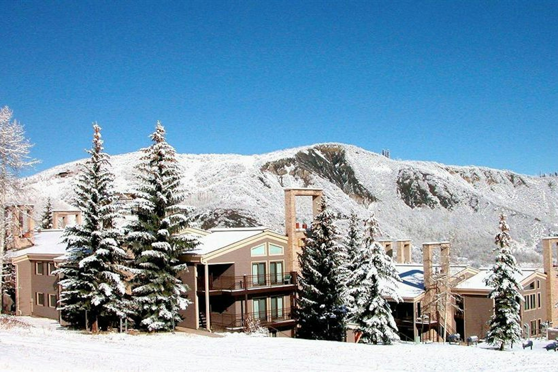 Front view of The Timberline Condominiums in the winter