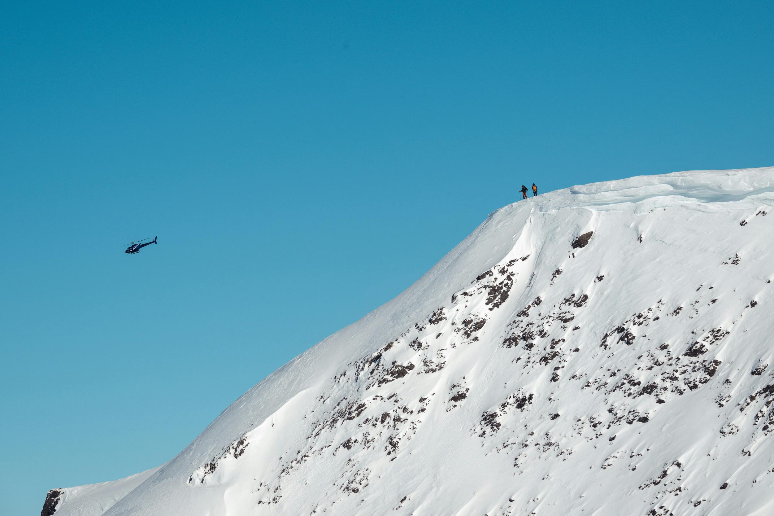 Two skiers about to kick off on a Crown Mountain Guides heli-skiing adventure in Alaska.