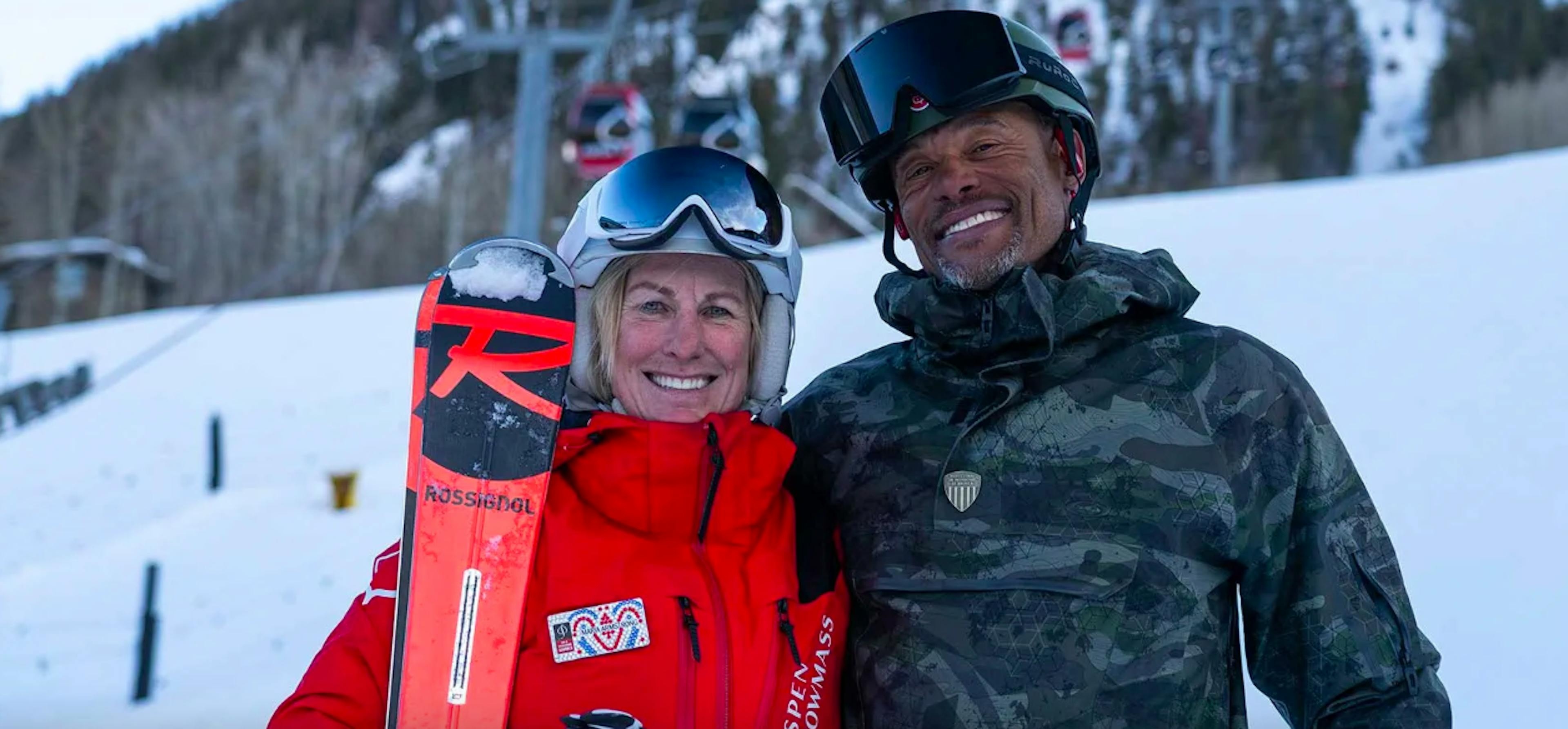 couple in ski clothes standing outside near Aspen ski resort