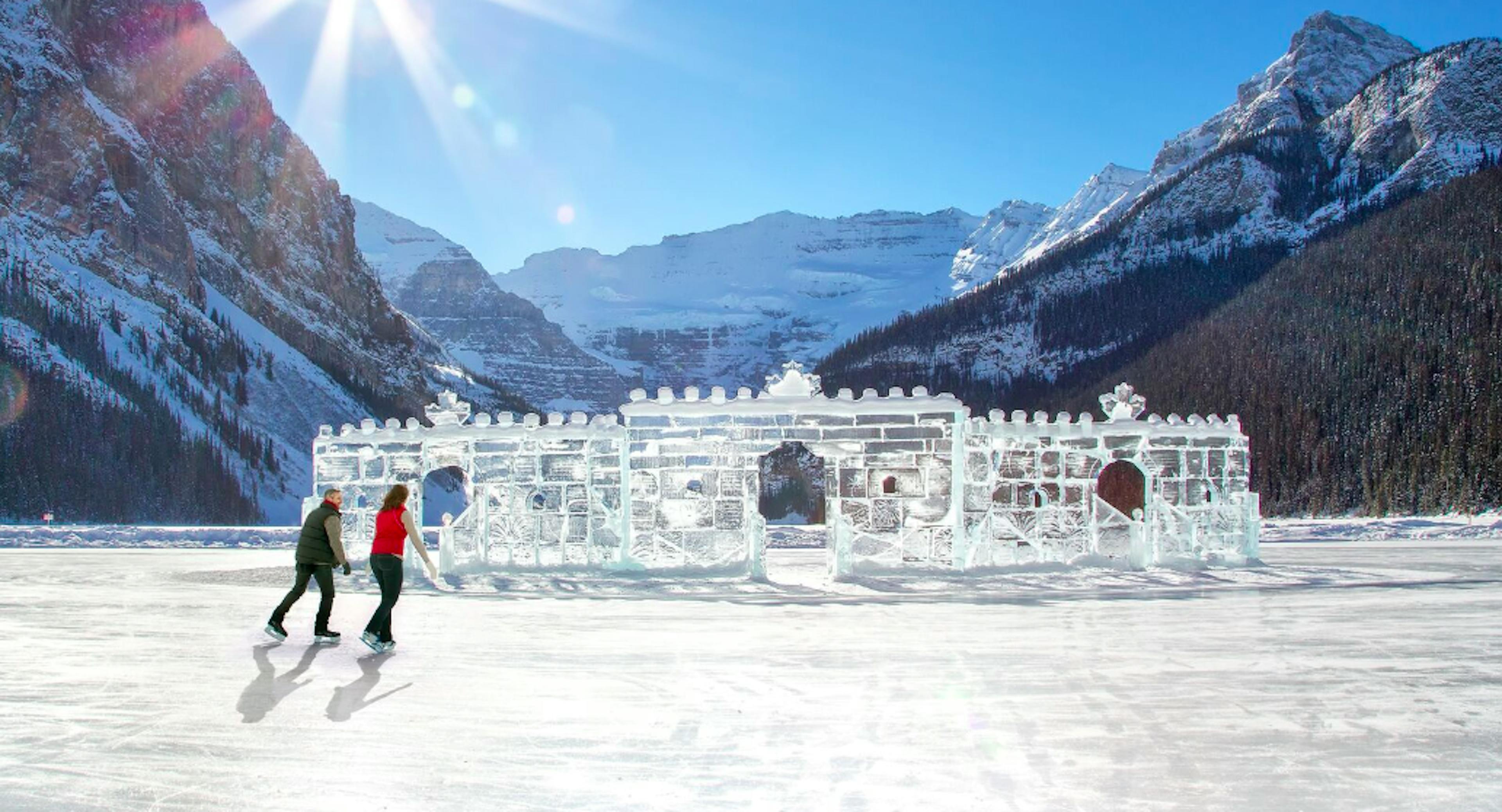 couple ice skating on Banff Lake Louise