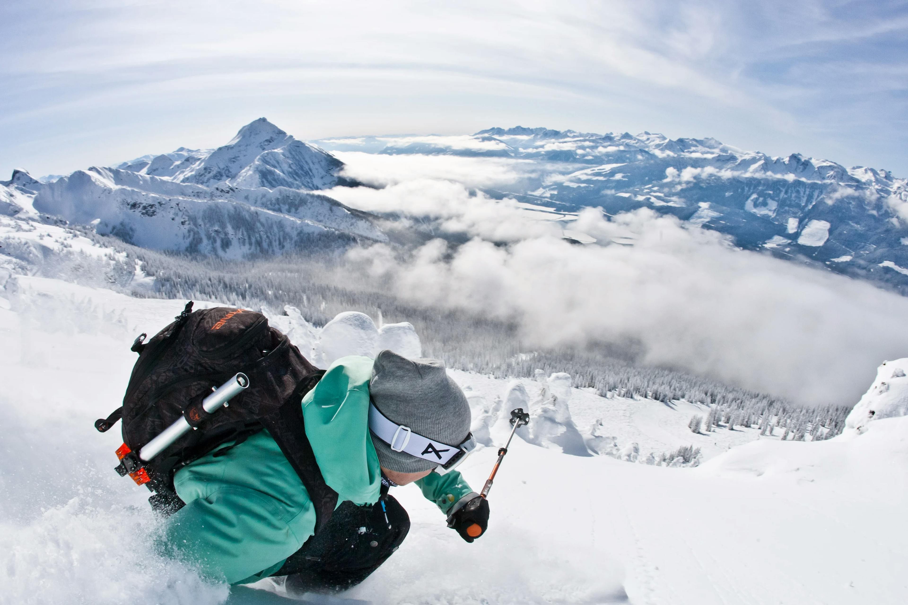 Skier skiing in deep powder snow.