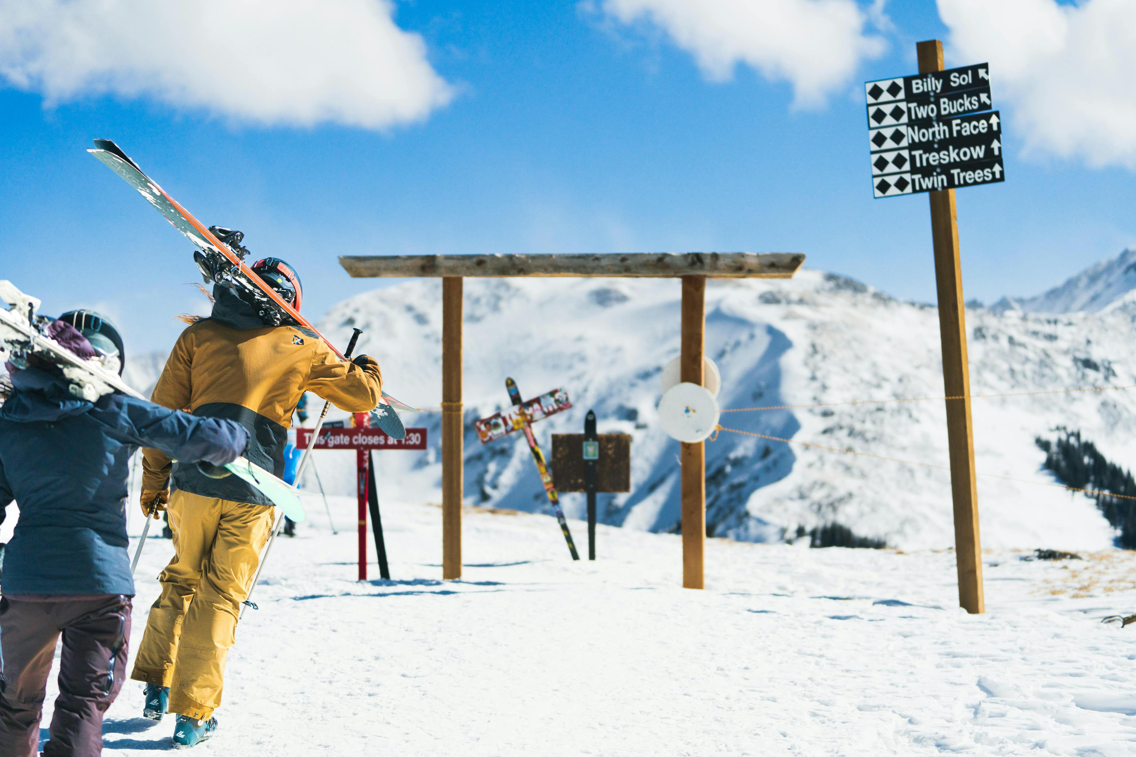 Skiers skiing double diamond trails at Taos.