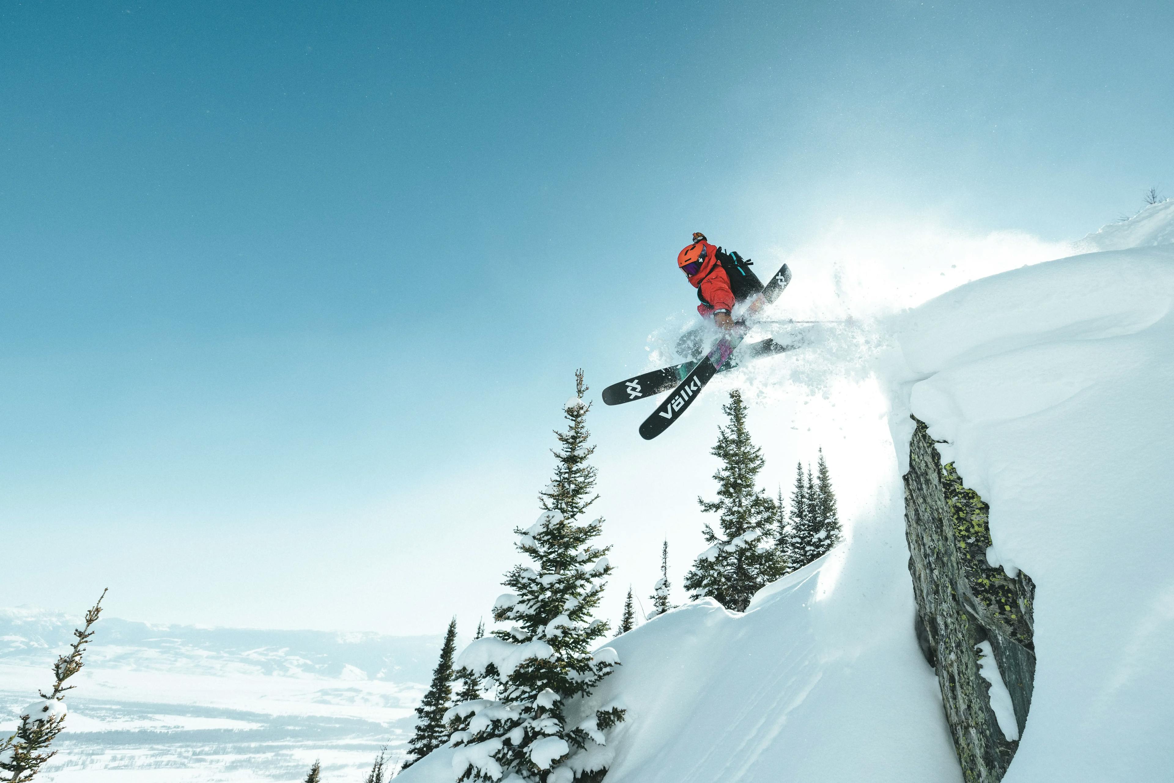 A skier jumping off a cliff at Jackson Hole Ski Resort.