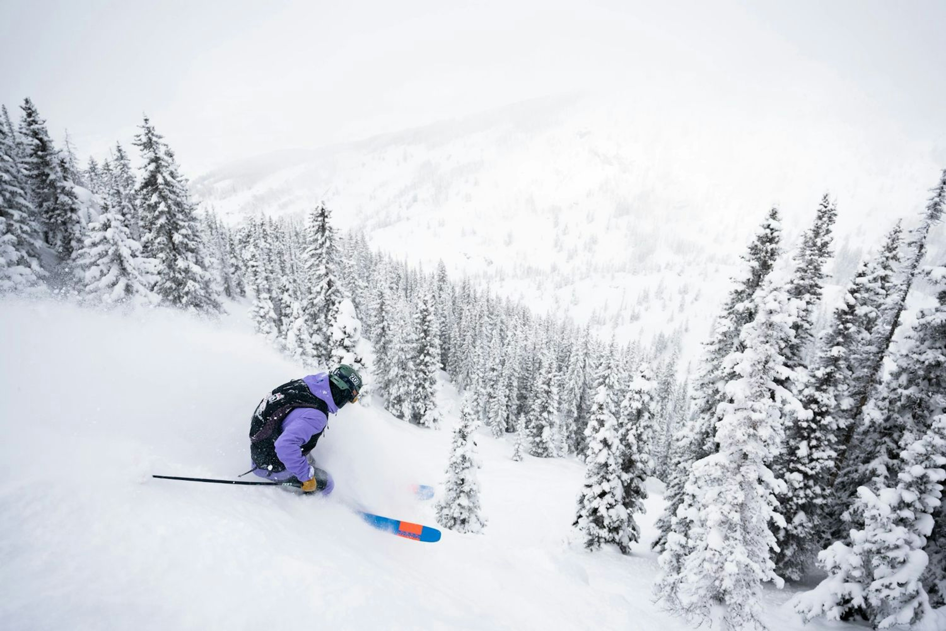 Skier skiing powder in Steamboat Springs