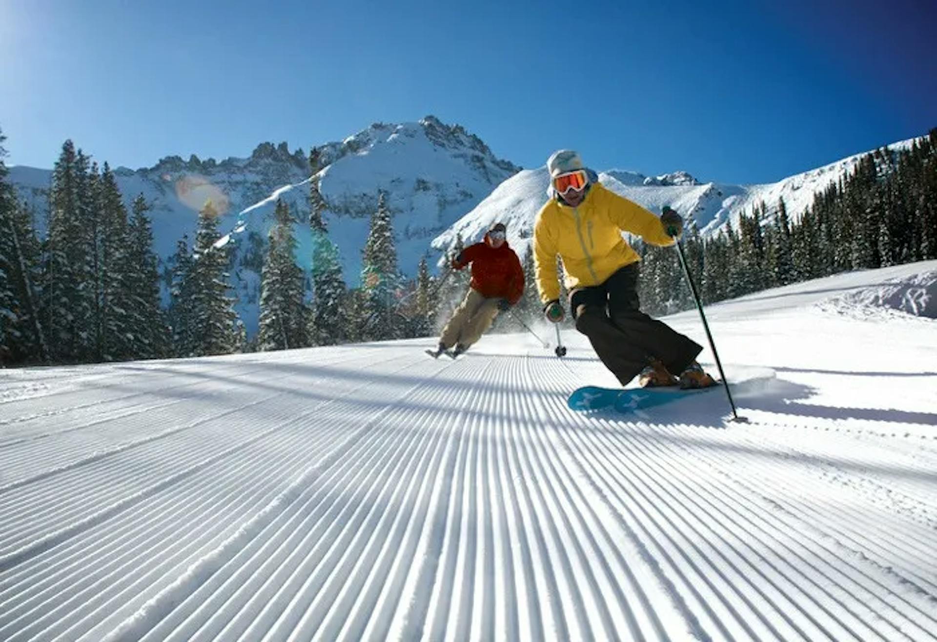 Skiers skiing groomers at Telluride Ski Resort.