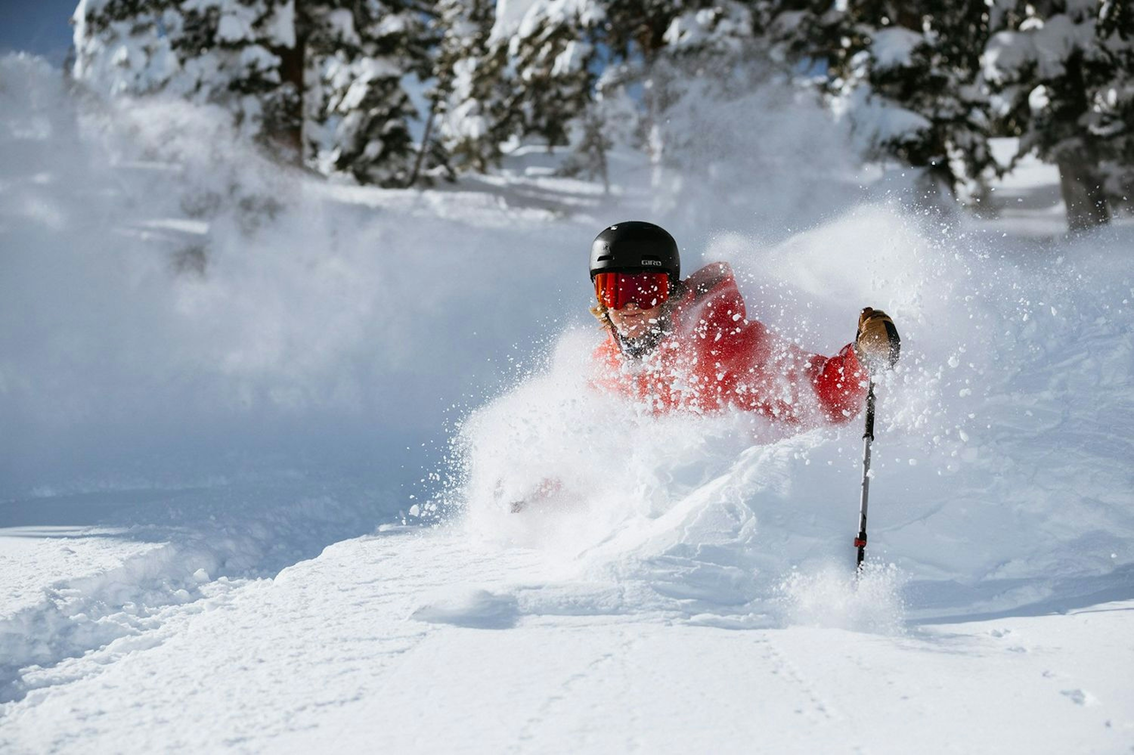 Skier skiing in deep powder.