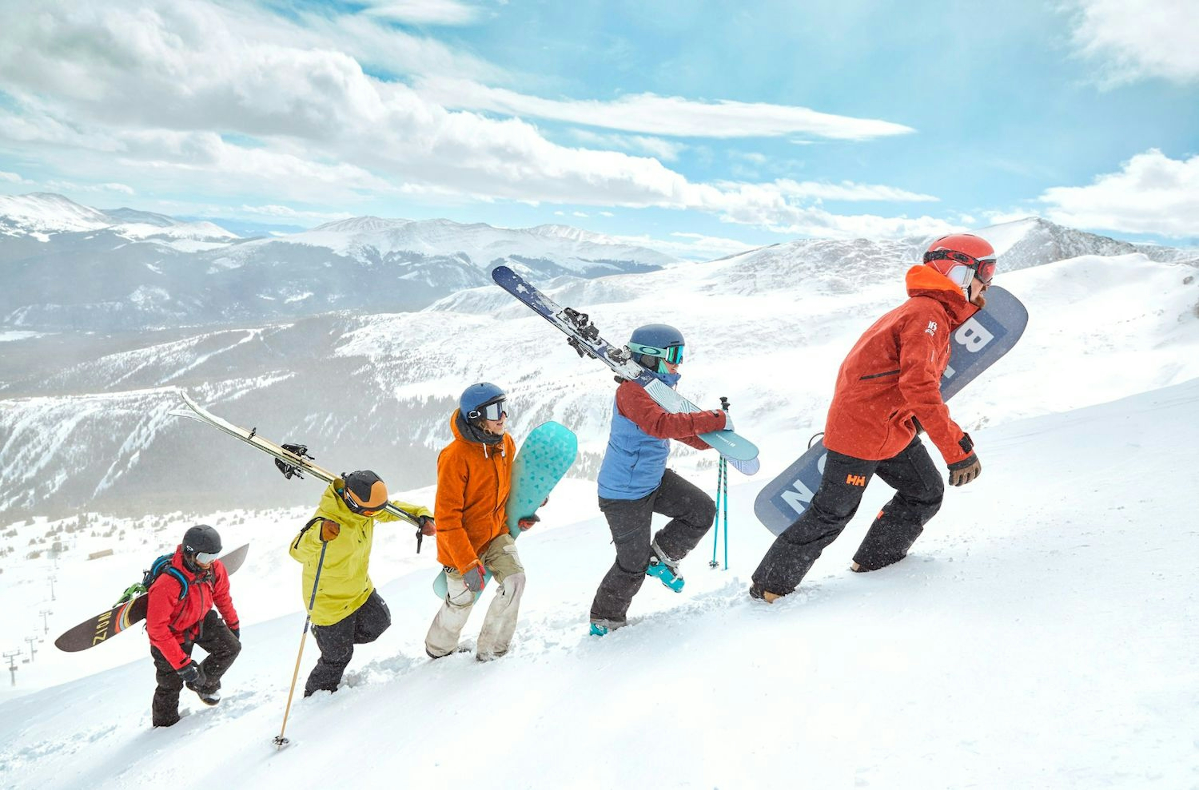 Skiers and Snowboarders hiking up Breckenridge Mountain.