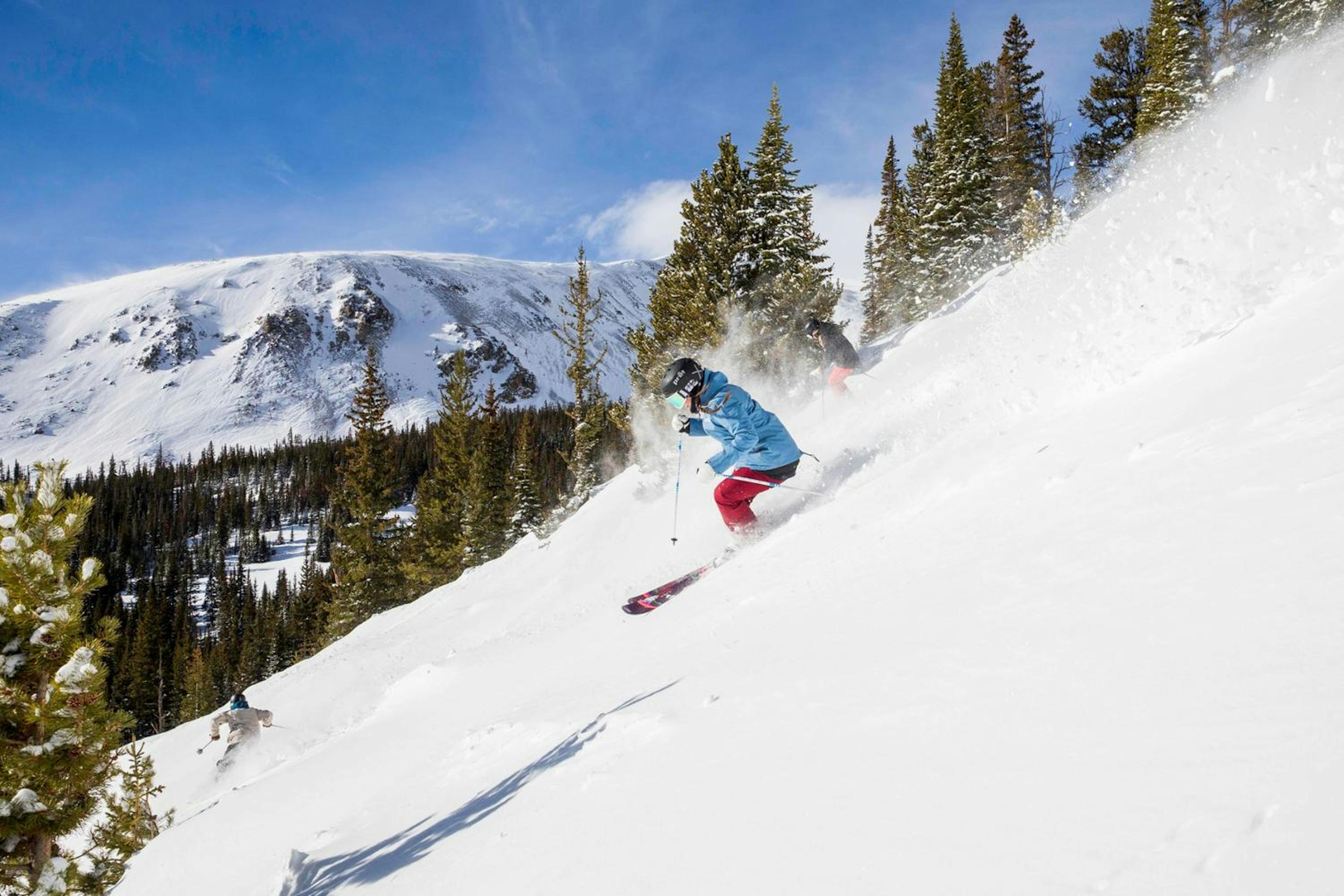 Skier skiing some powder at Breckenridge ski resort.