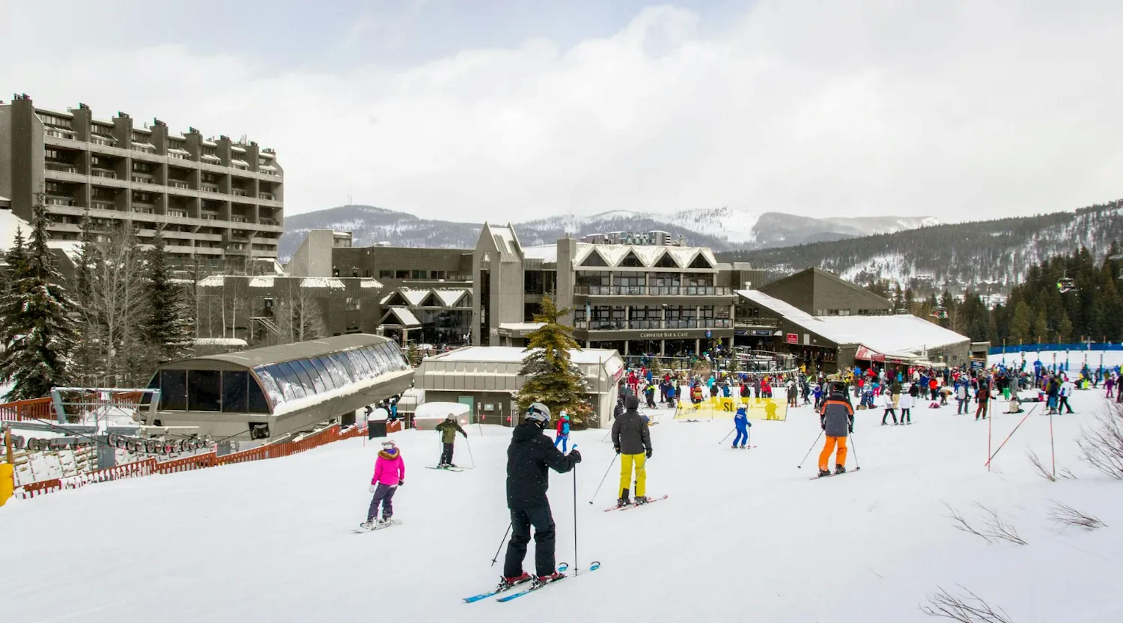 Skiers in front of Beaver Run in Breckenridge.