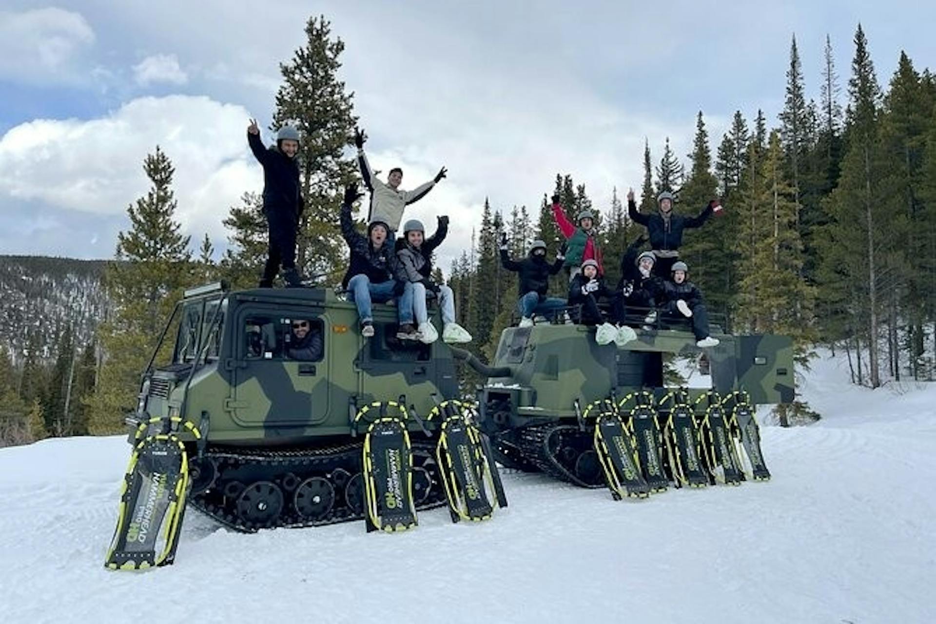 Extreme sledders on snow vehicles.