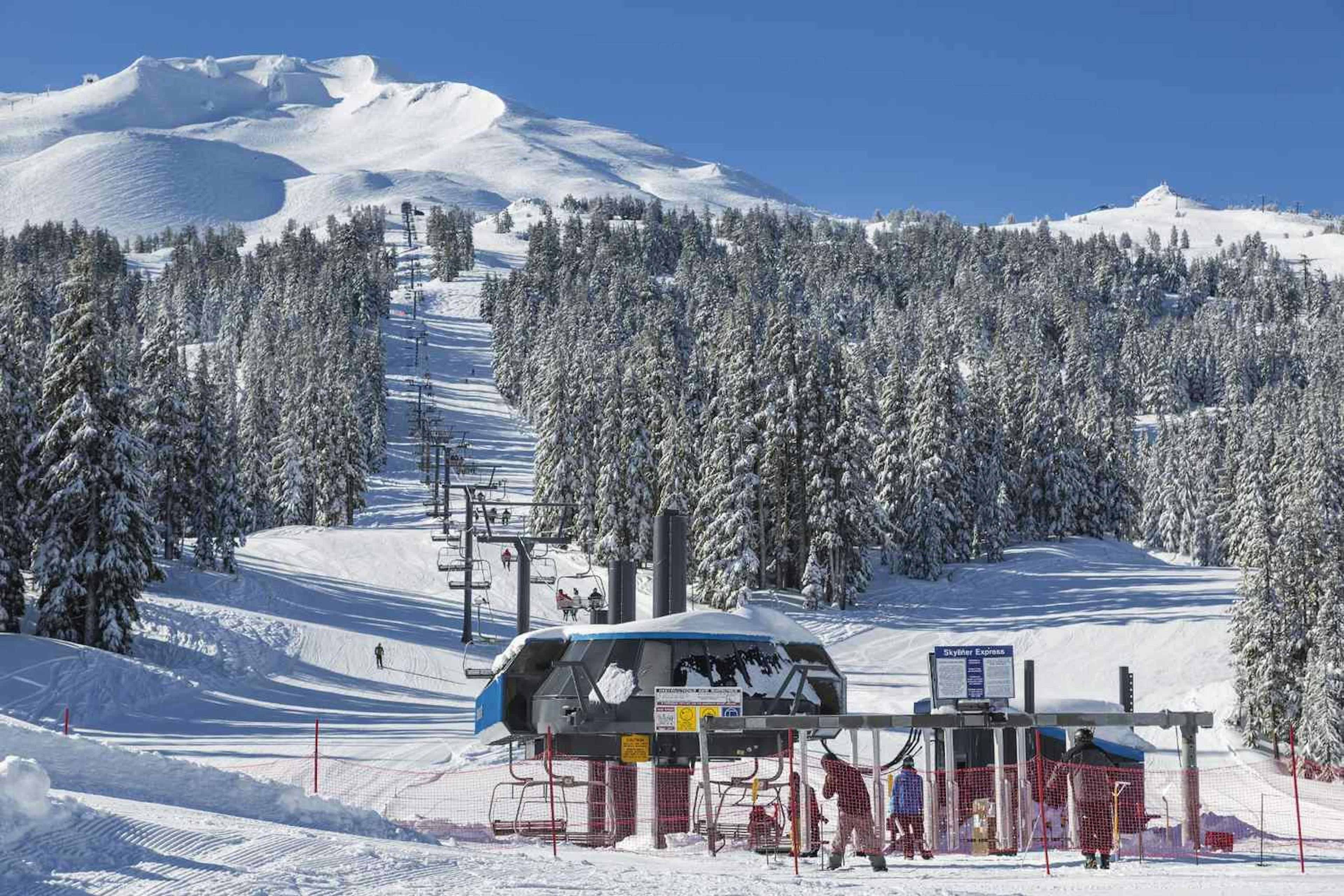 A ski lift running at the base of Mount Bachelor.