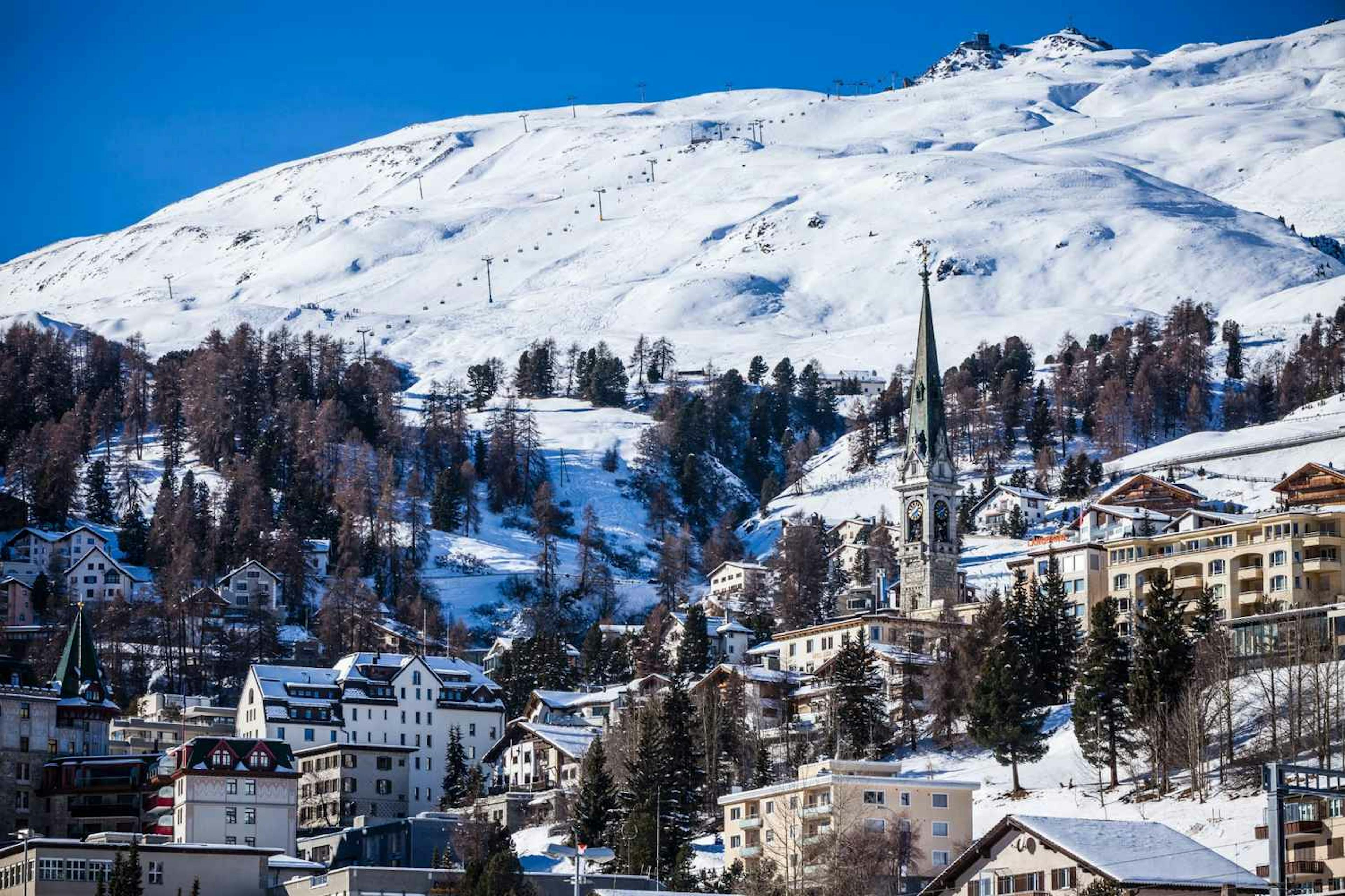 St. Moritz ski resort, Switzerland, with a snowy mountain background. 