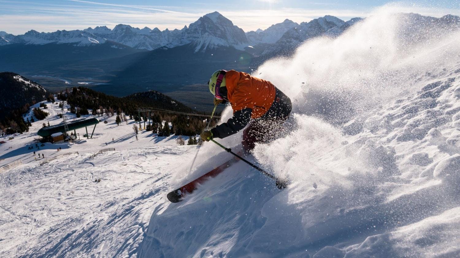 Skier skiing in powder at Banff Ski Resort.