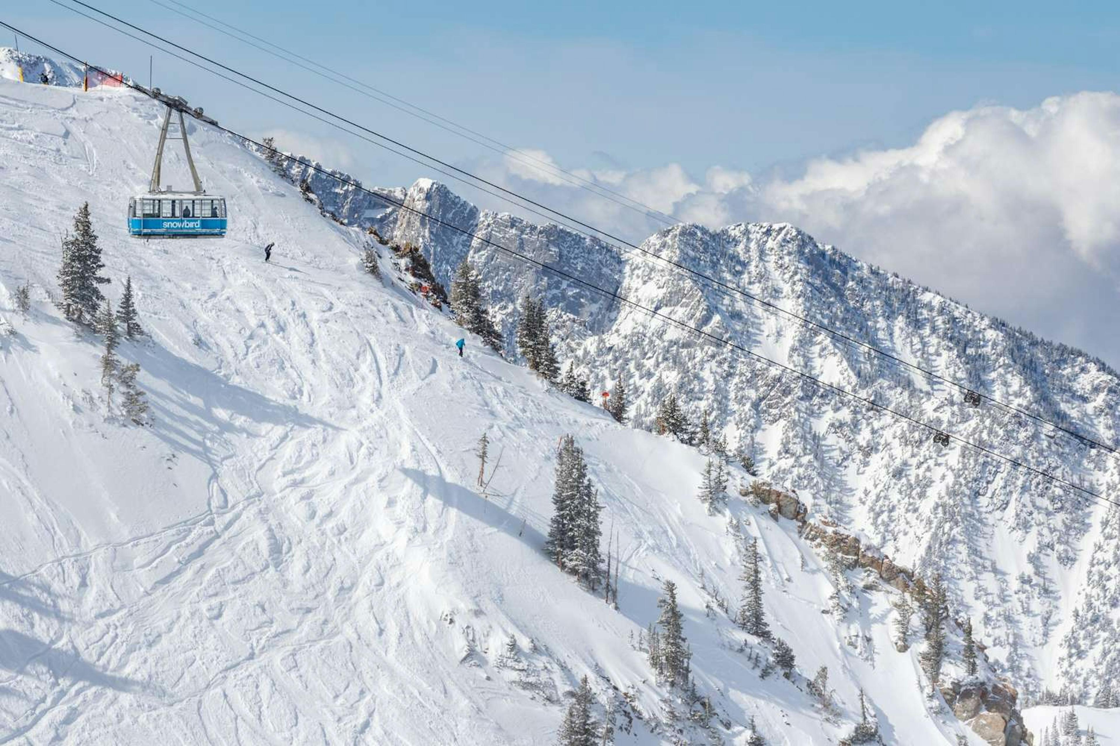 Tram and skiers at Snowbird.