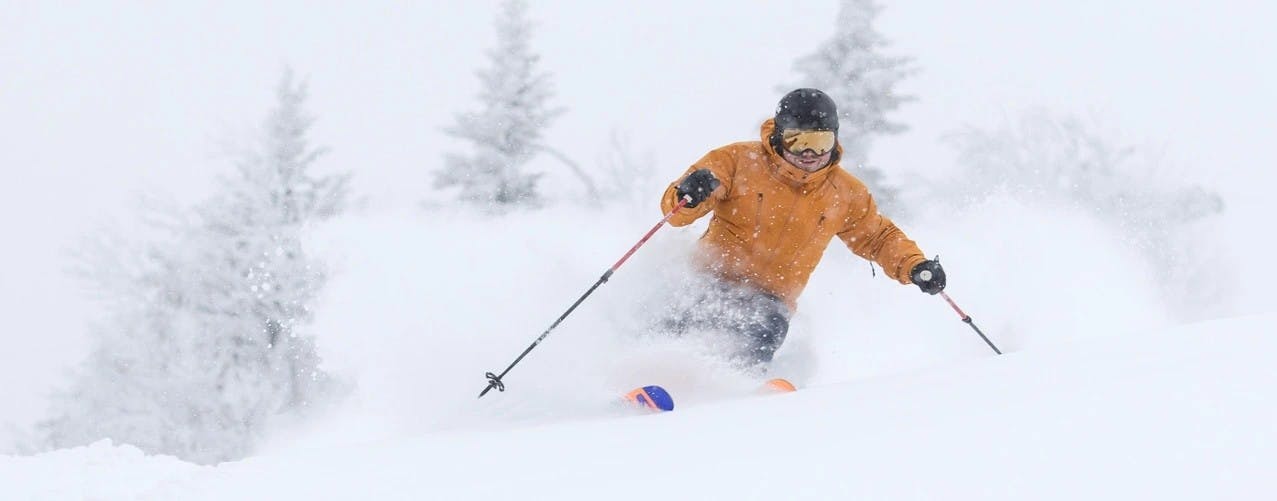 Skier in powder at Killington.