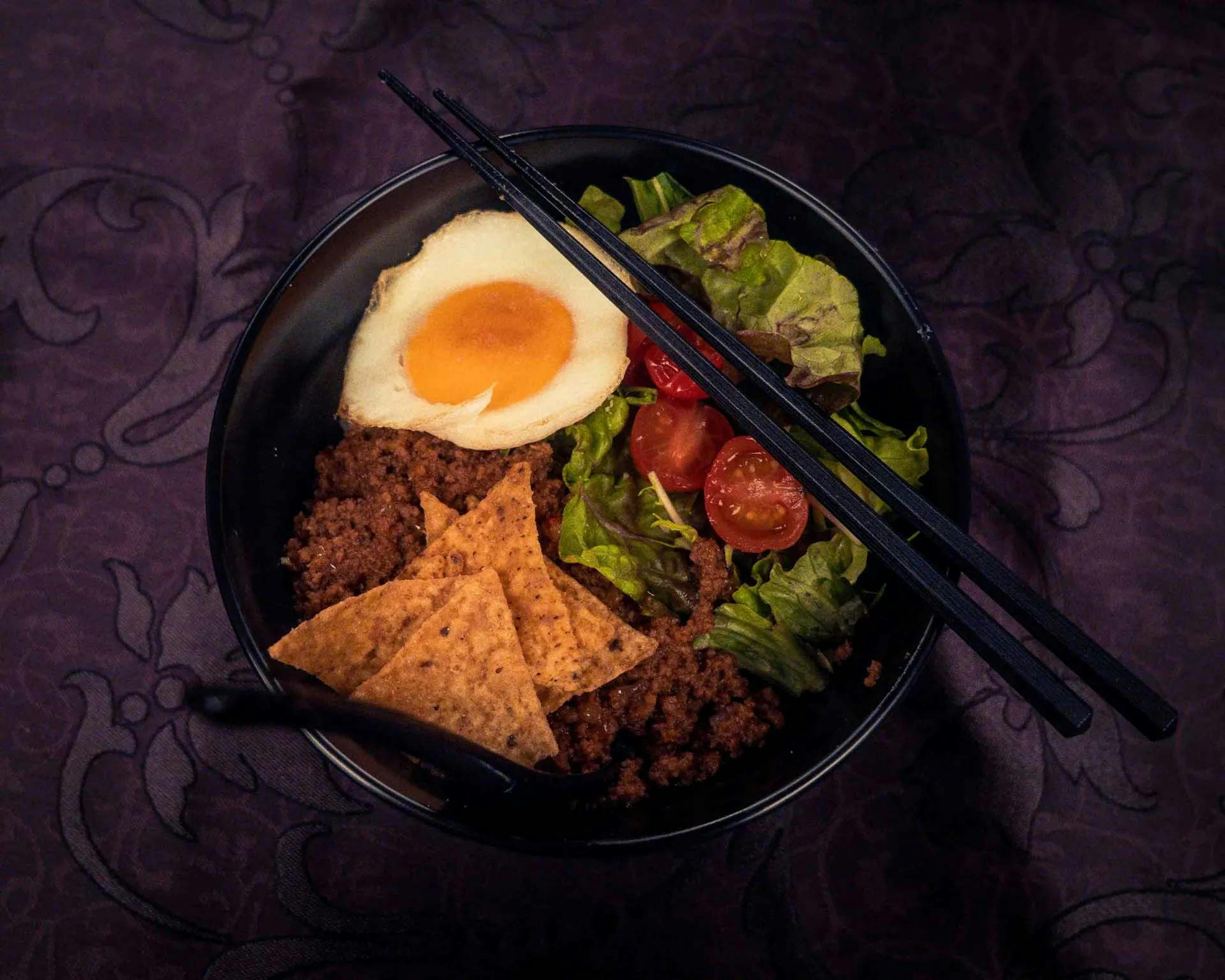 a photo of delicious Japanese ramen bowl with a perfectly soft boiled egg