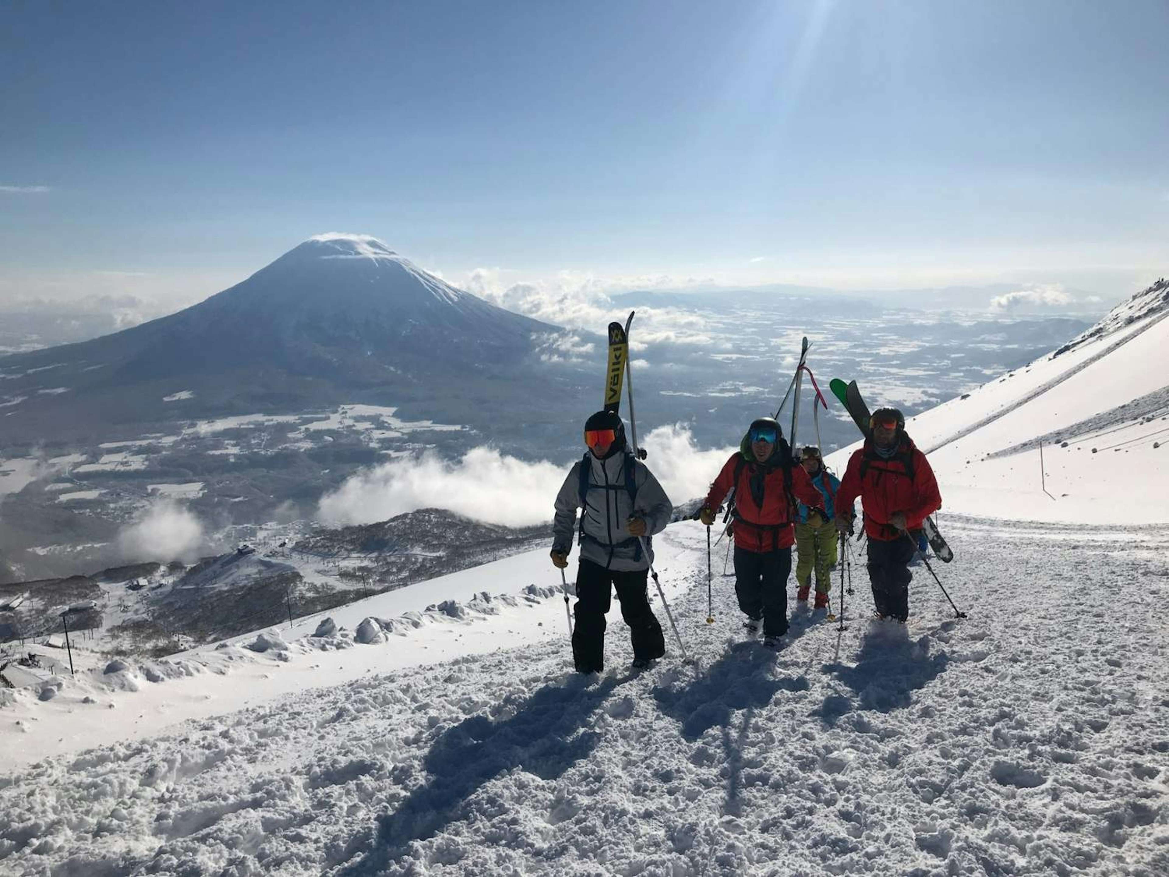 Group of skiers following their guide.