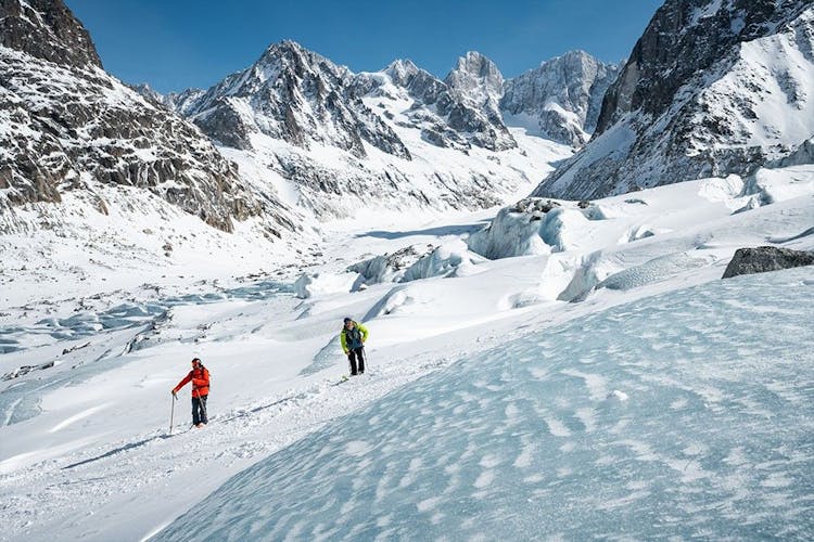 Two skiers skiing the slopes at Chamonix Mont-Blanc