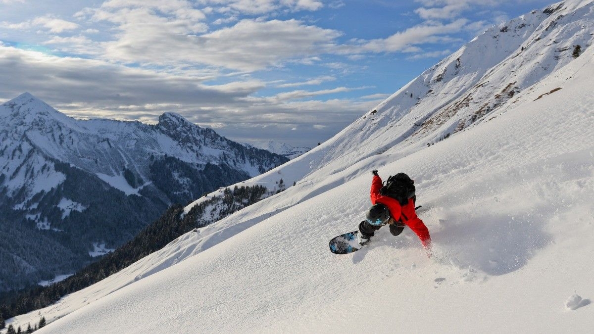 Snowboarder in powder at Morzine