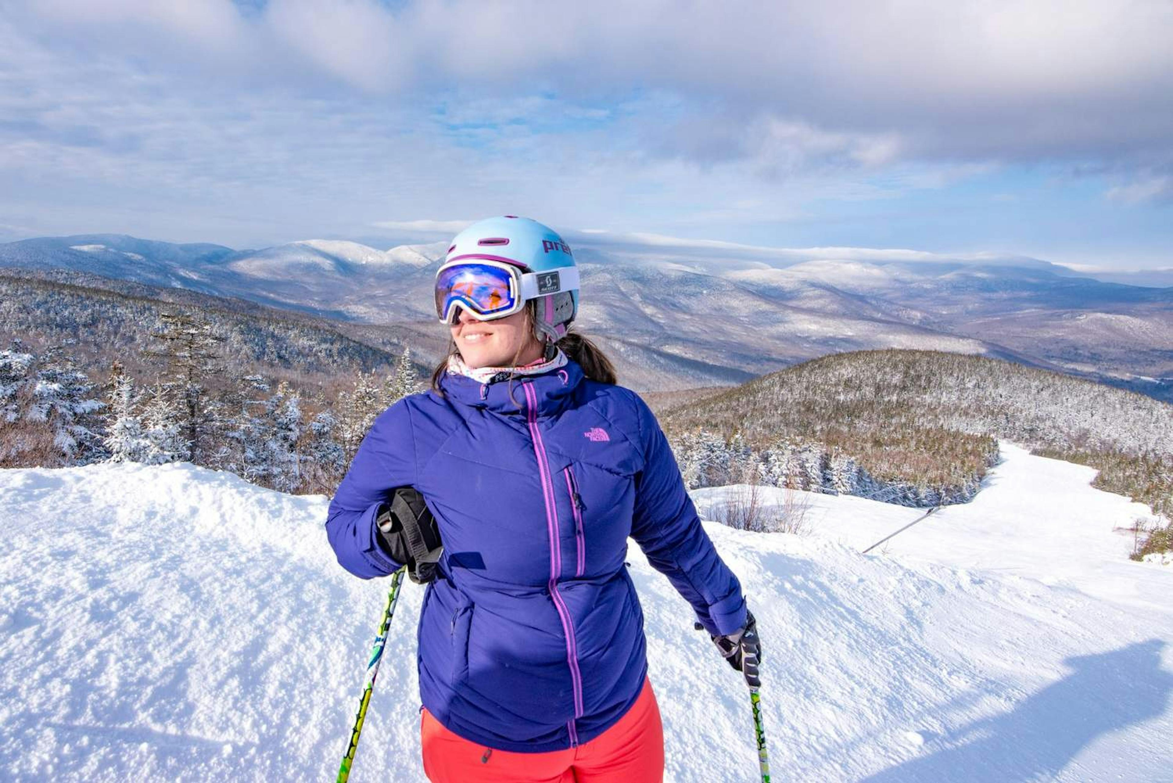 A happy skier in Sunday River against the horizon.