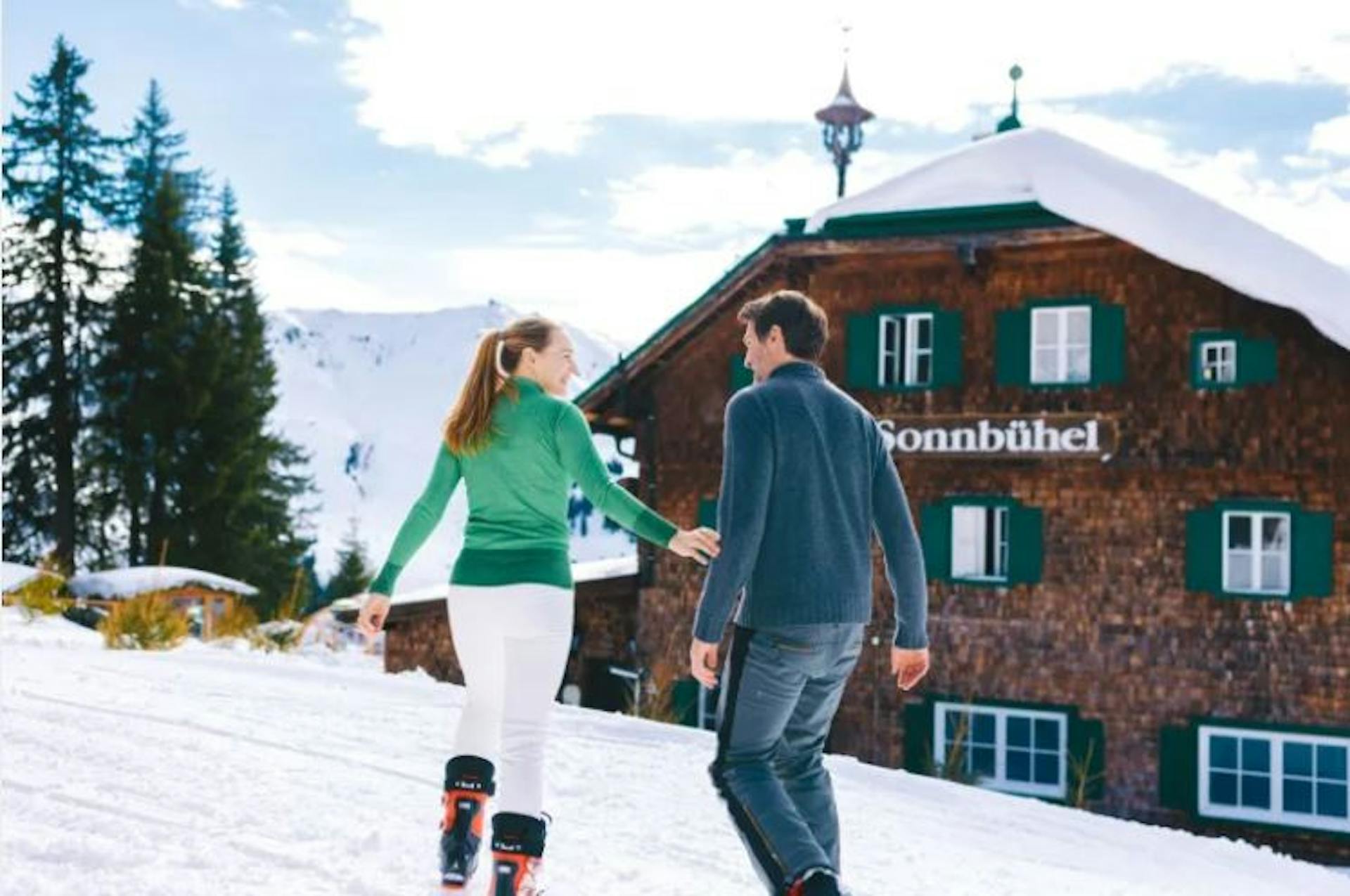 Couple walking to a restaurant in Austria. 